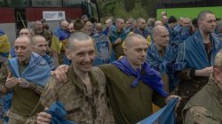 Prisoner swap goes ahead as Kyiv mourns 24 killed in Russian strike on flats