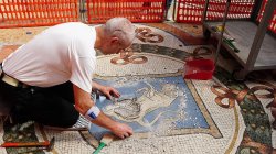 Italy restores lucky testicles on bull mosaic worn down by tourists