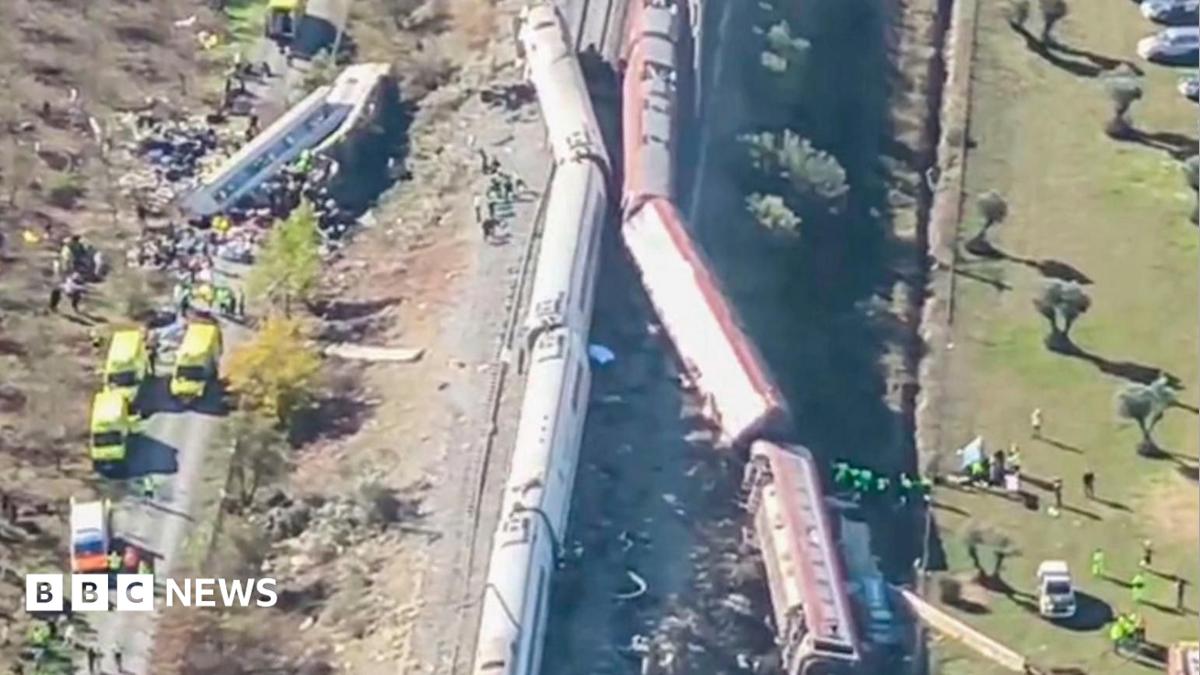 Overturned carriages and makeshift medical tents at crash site