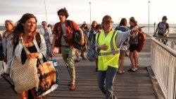 France orders evacuation of tourist spot as hundreds flee wildfires by boat