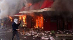 Violent clashes, looting and buildings ablaze in France as over 1,000 arrested after protests