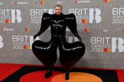 Sam Smith's worst outfits ever as they struggle to walk in 52 pound gown