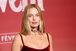 Margot Robbie wows in bikini in stunning beach snaps
