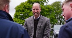 Prince William dishes out cake as he arrives for key outing