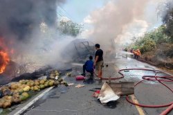 Indonesia bus crash: 16 killed as passenger bus hits oil tanker in Sumatra bus fire