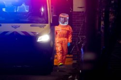 Moment air crew mask up in front of terrified passengers after 'in error' ebola threat