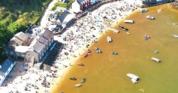 Horror moment sea turns brown at popular beach