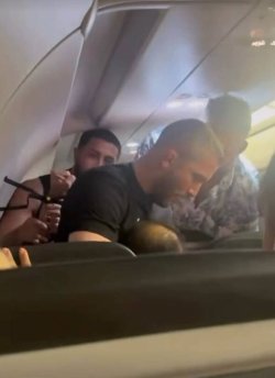 MMA fighter steps in as passenger 'tries to open plane door' on Frontier flight