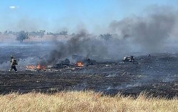 Two killed after deadly helicopter crash as blaze forces homes to be evacuated