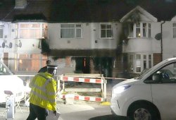 Murder probe launched after London house fire kills woman and injures eight