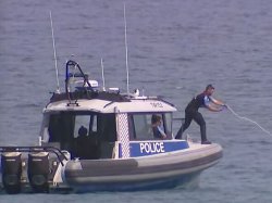 Swimmer, 63, killed in shark attack as police search for body and 'destroy order' issued