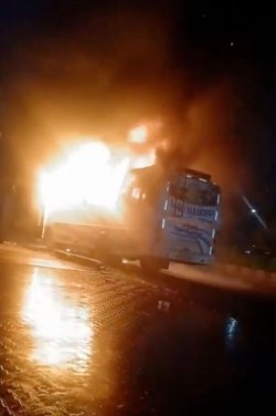 At least 9 dead after fire rips through bus and terrified people jump from windows