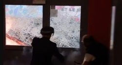 Chaos in Paris as furious rioters try to set fire to school's door with pupils inside