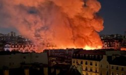 Huge fire rips through Paris with iconic landmark 'totally destroyed' in blaze